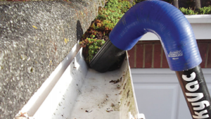 Gutter cleaning [location] using a gutter hoover